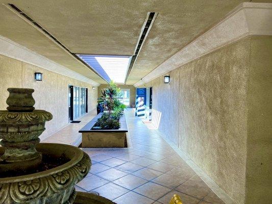 The entrance is down this corridor