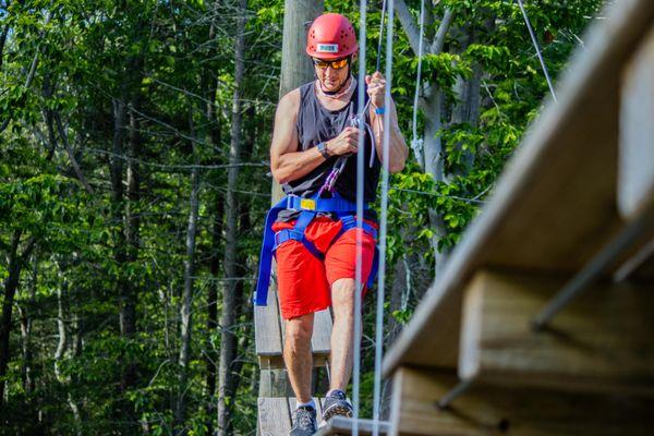 At our ropes course, we welcome people 10 and up. Challenges are adjusted based on the group's goals and vision for their day.