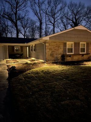After photo a recent renovation. New walkway, sod, lighting, paver patio and sitting wall.
