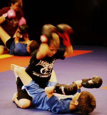 We have trained State Grappling Champions in the kids and teens divisions, not just adults.