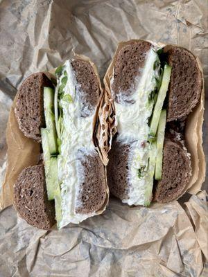 Caraway Salt Pumpernickel bagel with plain cream cheese, daikon sprouts, and cucumber