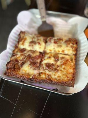 Sausage and bacon Detroit pizza