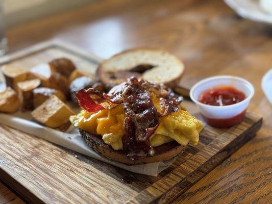 Beef bacon egg and cheese on everything bagel