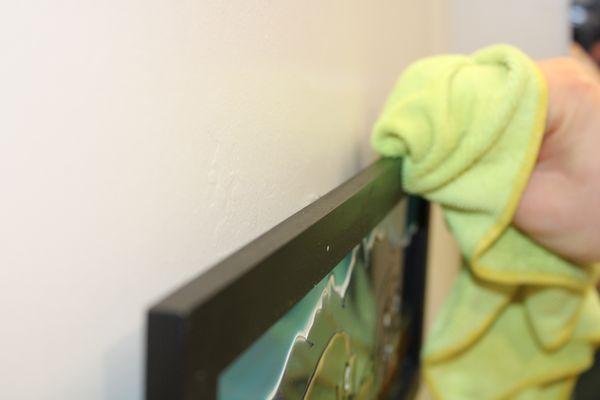 Dusting the picture frames in your house