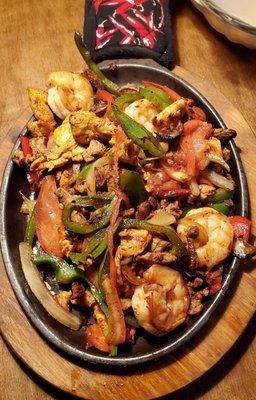 Vaqueros fajitas, shrimp, steak, and chicken