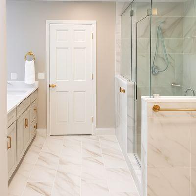 New primary bathroom remodel with custom porcelain tile oversize walk-in shower