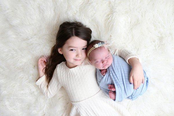 photo of newborn and older sister