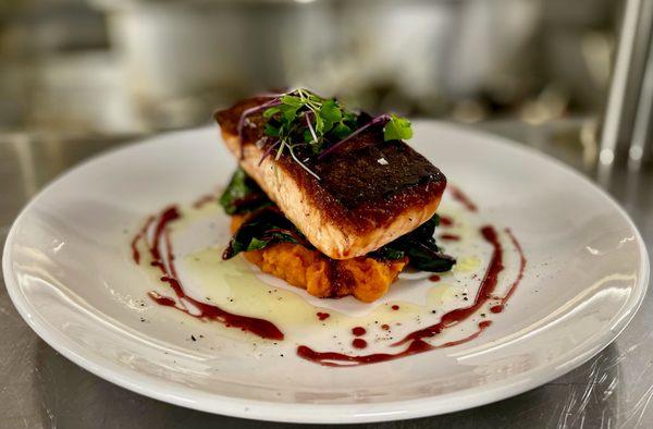 Crispy-Skinned Salmon - with butternut squash puree, wilted greens and pomegranate glaze.