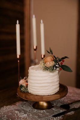 One of our custom wedding cakes, topped with fresh flowers