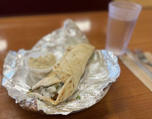 Falafel Sandwich w/ side of Hummus. Soft, fluffy pita. Crispy, crunchy falafel. With tahini and pickles. The perfect lunch.