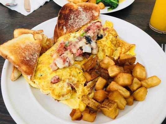 Corned beef omelette supreme. $10.99. Really good. Fresh mushrooms!!