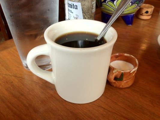 Good coffee served with a tiny little cup of cream. Cute.