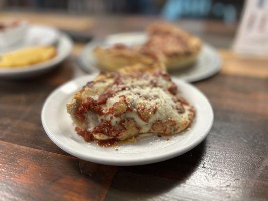 Medium deep dish slice (pepperoni & sausage)