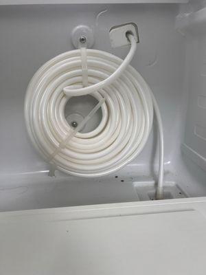 The banded hose that limited my water pressure in the refrigerator