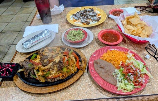 Fajitas with corn tortillas and arroz con pollo with steak