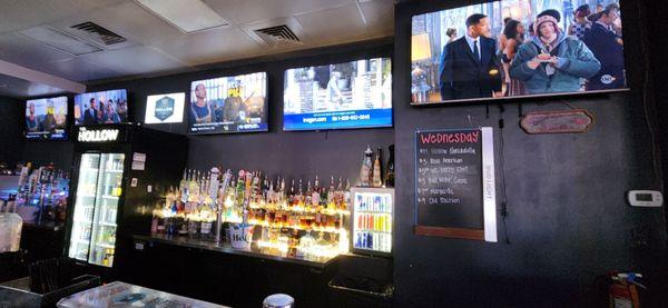 Bar with many TVs showing various sports and Men In Black