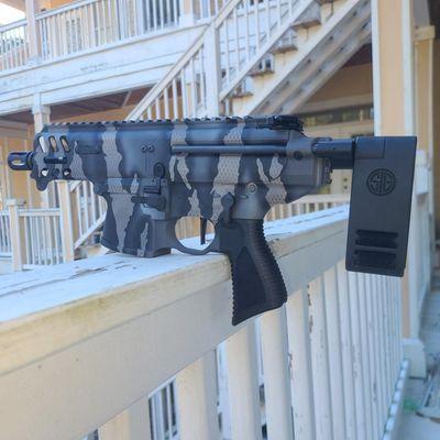 Sig Copperhead done in a riptile Cerakote finish.