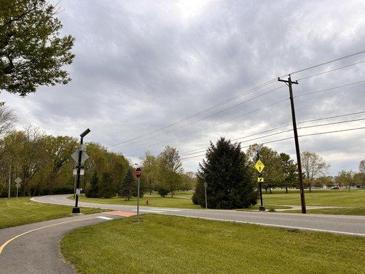 Where the path coming out goes to clearcreek park. Lit crossing path.