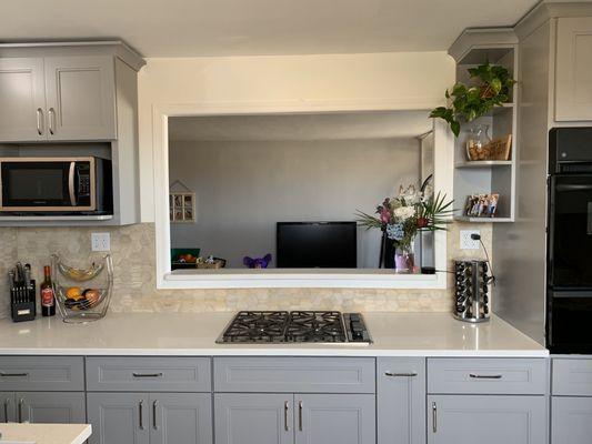 Opening in wall added; new cabinets, countertops, floors and backsplash