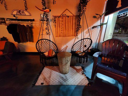 Swinging Chairs near the entrance.