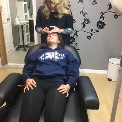 Little niece getting her brows done