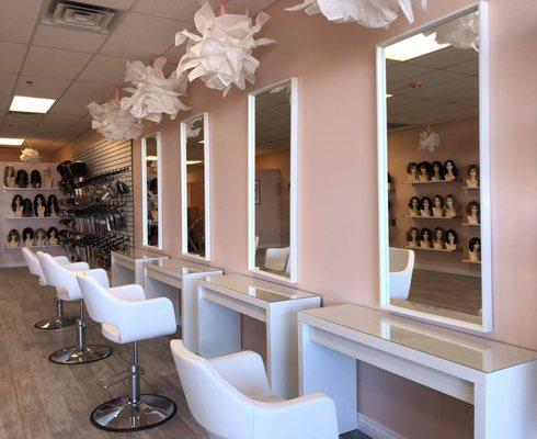 Spacious upscale wig salon with a private room for makeup or consultations
