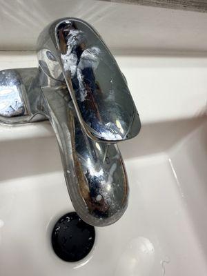 Filthy, broken faucet