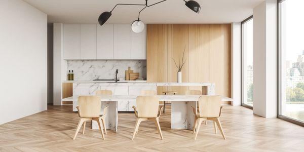 Sleek NYC kitchen & dining space with marble, wood & skyline views--SpecLand Group designs bright, modern interiors with luxury finishes!