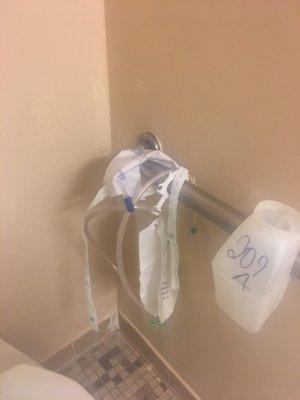 This was left in the bathroom. A used tube and bag with urine should be discarded.
