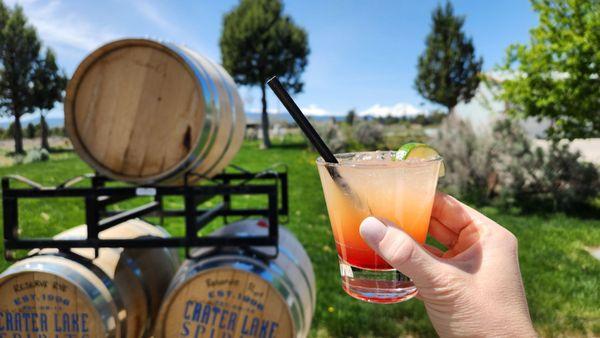 Outside with a sunset cocktail