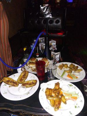 $60; 20 wings by two flavors, 4 turkey sliders with, potato skins and a large hookah.