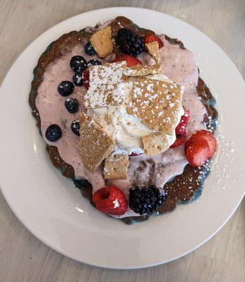 On the side: Berry Tart - Lemon blueberry cakes, topped with graham crackers, fresh berries, and a warm homemade lingonberry cream sauce.