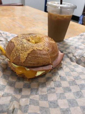 Breakfast sandwich. No tomatoes. With ham egg and cheese on cheese bagel.