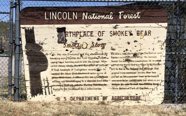 Exterior: weathered origin sign adjacent to park