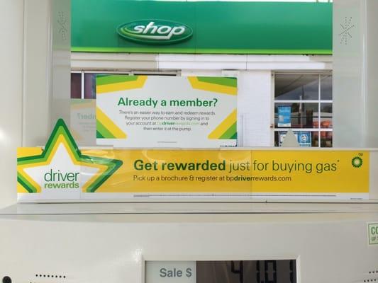 The station has signs for the driver rewards program.