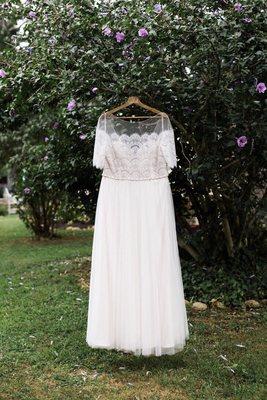 The bottom hem shows how uneven it was done. I constantly stepped on that part of the dress on my wedding day, even after it was "fixed."