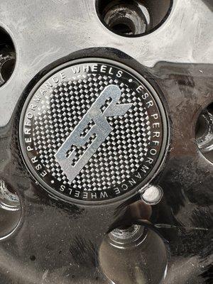 Huge chip next to my center cap. This happened when they were balancing the wheel.