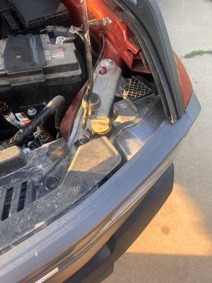 Cap left on the inside of hood by hood stand.