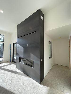 Sheet metal cladding for your homes fireplace or interior walls.