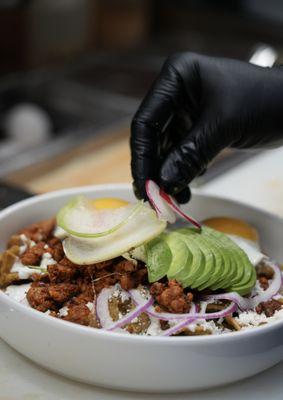 Chilaquiles, green salsa, chorizo and sunny side uo egg