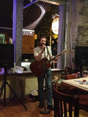 Photo of Houston based Salubrious Sounds guitar teacher, Louis Pionessa, performing live in Corning New York.