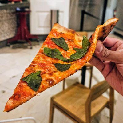 Perfect plain cheese slice with fresh basil