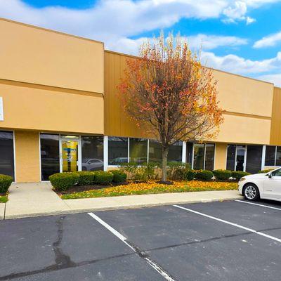Storefront entrance of Binson's Medical Equipment & Supplies in Indianapolis, IN, showing the front door and parking spaces.