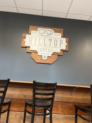 The bar is made of old wooden bleachers for the original shop, that used to be a school. Great use of repurposing.