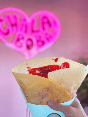 Crispy crepe with strawberries, strawberry syrup, and cream cheese!