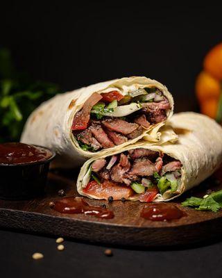 Beef BBQ Wrap -- juicy grilled beef with fresh veggies, wrapped in lavash and served with house-made sauce