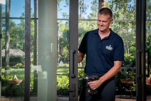 Repairing a sliding-glass-door lock to keep coastal homes safe and breezy year-round.
