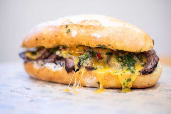 Chimichurri steak sandwich with Tillamook cheddar, served hot!