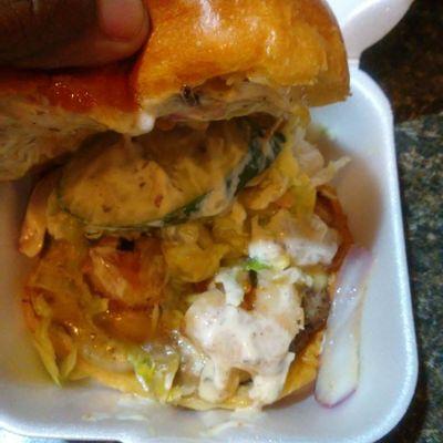 My steak burger with shrimps lettuce marinated onions and cucumbers and garlic mayo