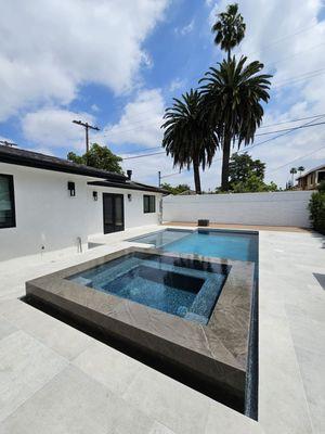Backyard remodel new construction pool with raised spa